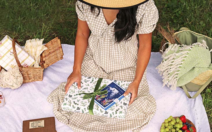 girl holding making meadows wrapping paper