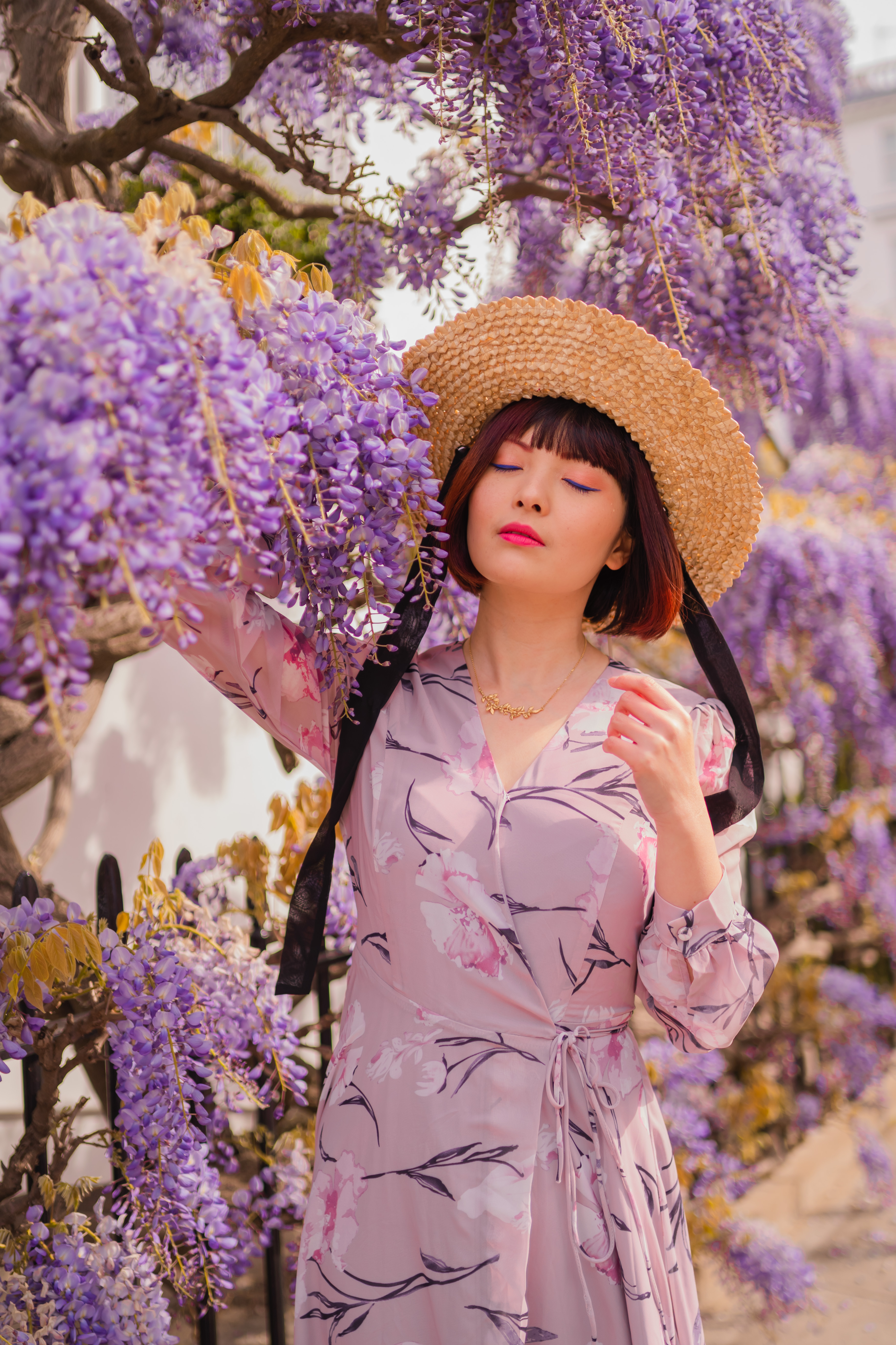 Model wearing gold laurel and wren necklace