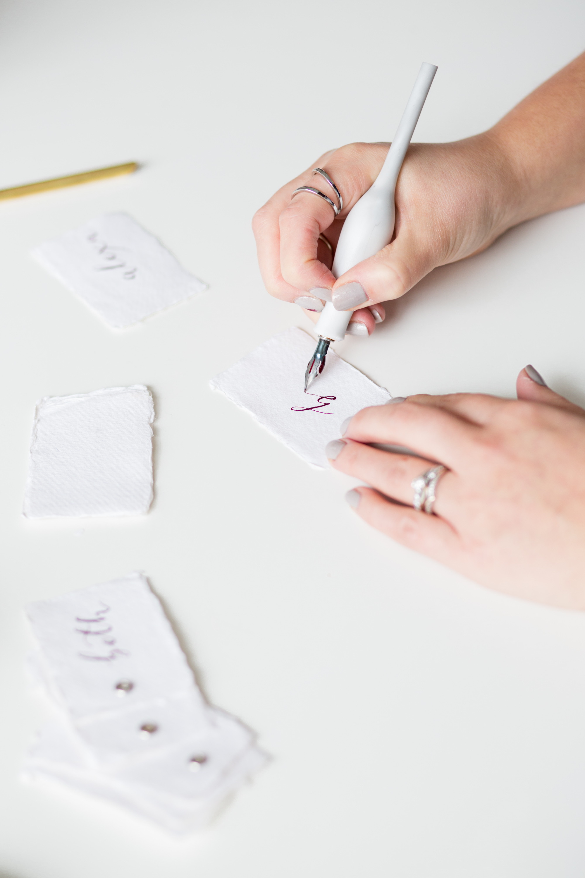 White Olive Design Studio modern calligraphy wedding place settings