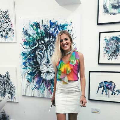 A picture of me at my solo exhibition of animals, this lion is one of my favourite pieces.