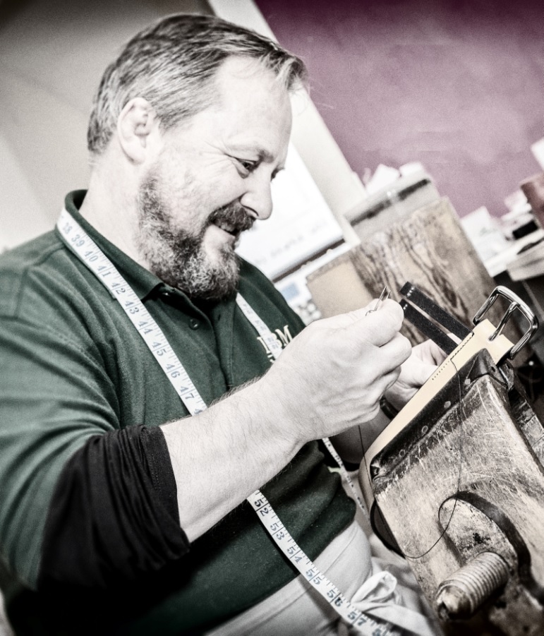Mark handstitching a belt