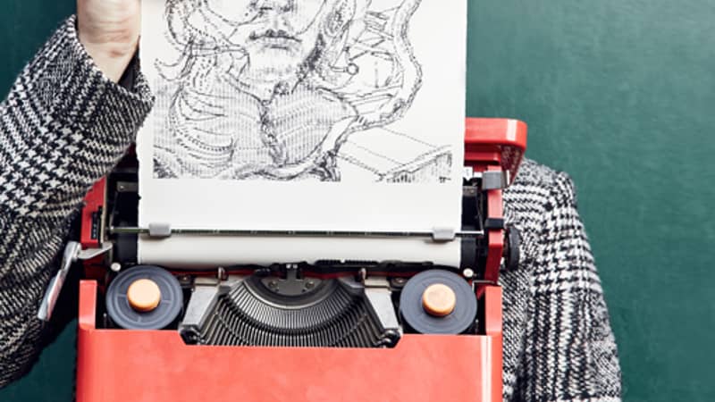 Keira Rathbone Typewriter ARtist portrait with typewriter and self portrait typewriter art work in front of face, fingers on keys and holding paper