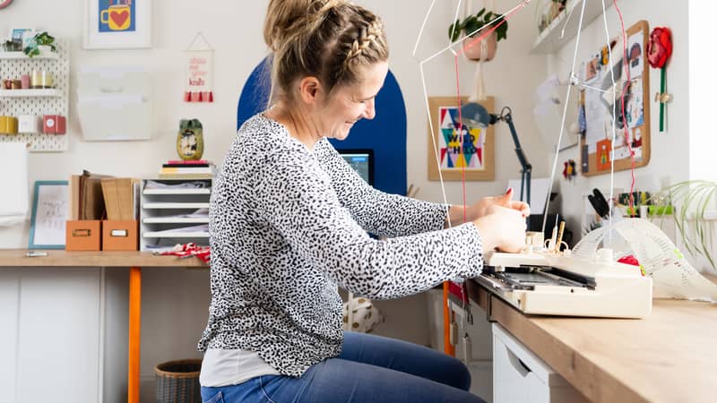 Rosie knitting at her machine