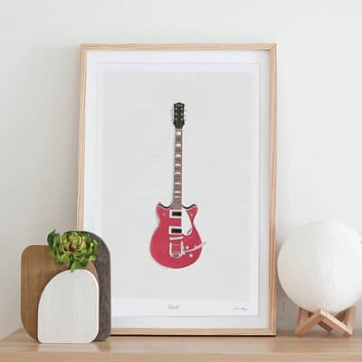 A framed art print featuring a handprinted Gretch guitar by Emma Bryan Design
