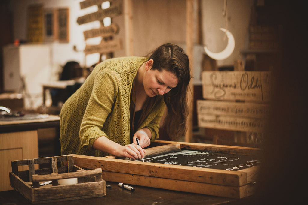 Suzanne creating a hand painted artwork