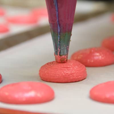 Hand piping our macaron shells