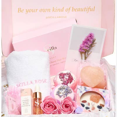 Self-Care Gift Hampers. This delightful gift hamper is perfect for the holiday season. It includes a scented candle, crystals, bath bombs, essential oils, a hai