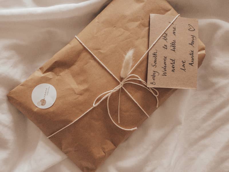 rustic packaging in neutral tones. gift wrapping in parcel paper and string