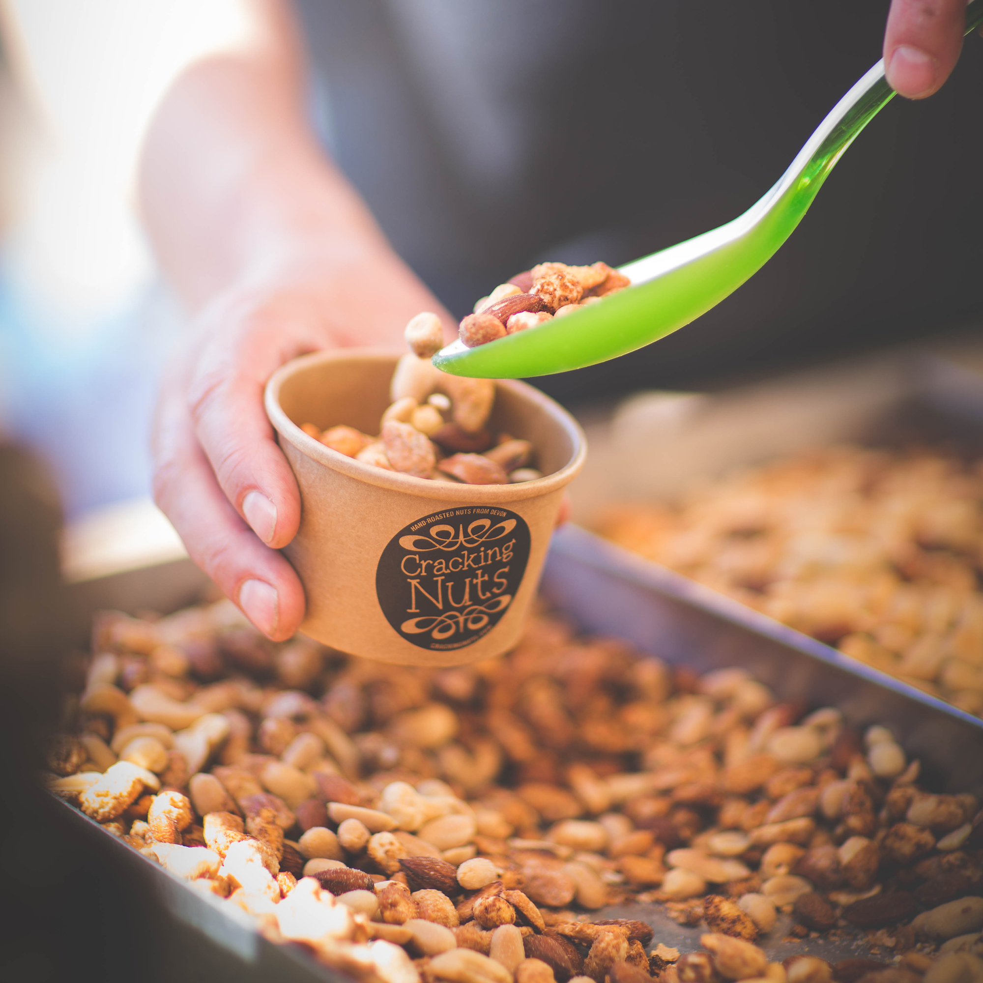 Serving up the freshly roasted mixed nuts