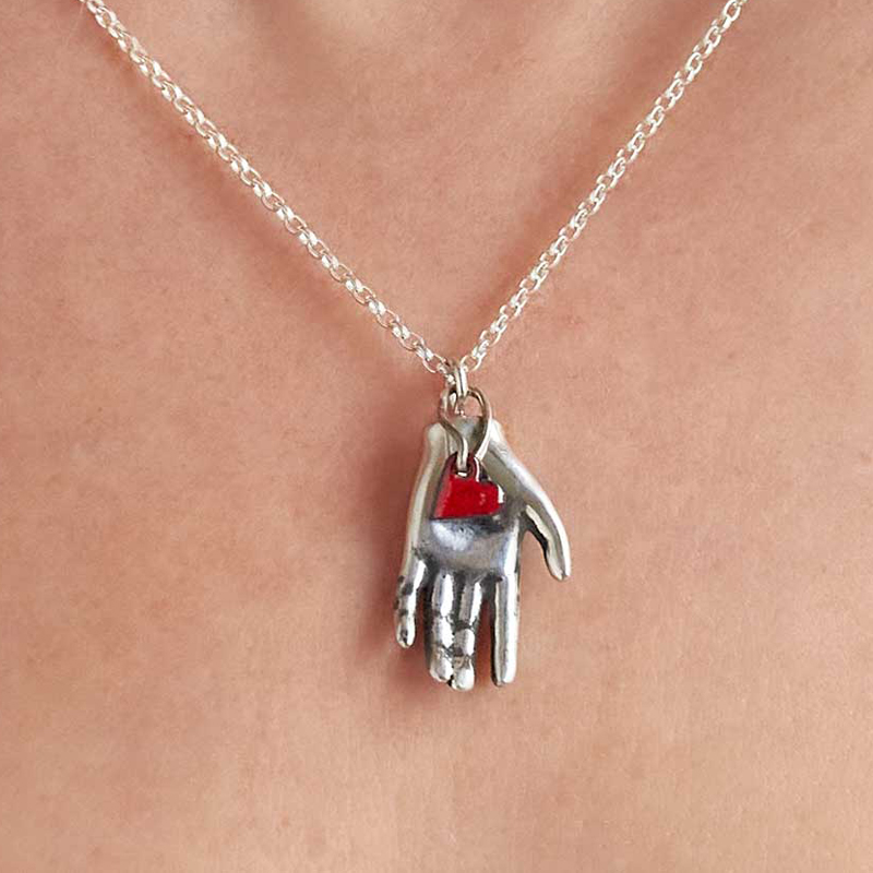 Red Heart in Barbie Hand from All That Glitters