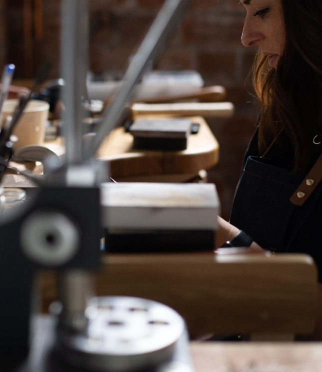 Zoe, Hello Halfpenny at her bench hand making jewellery 