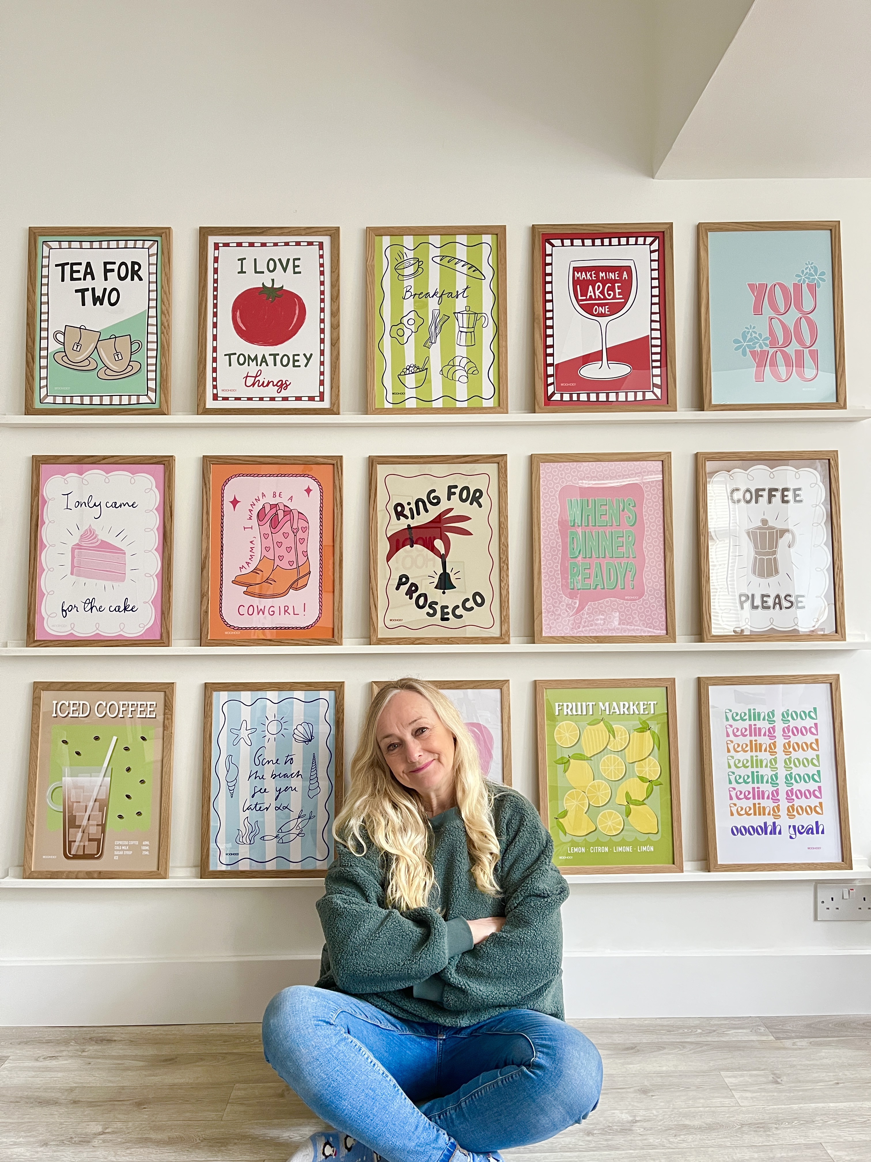 WooHoo Prints, Mandi sat under gallery wall in her studio