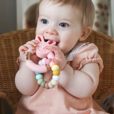 Millie with her personalised bunny teether