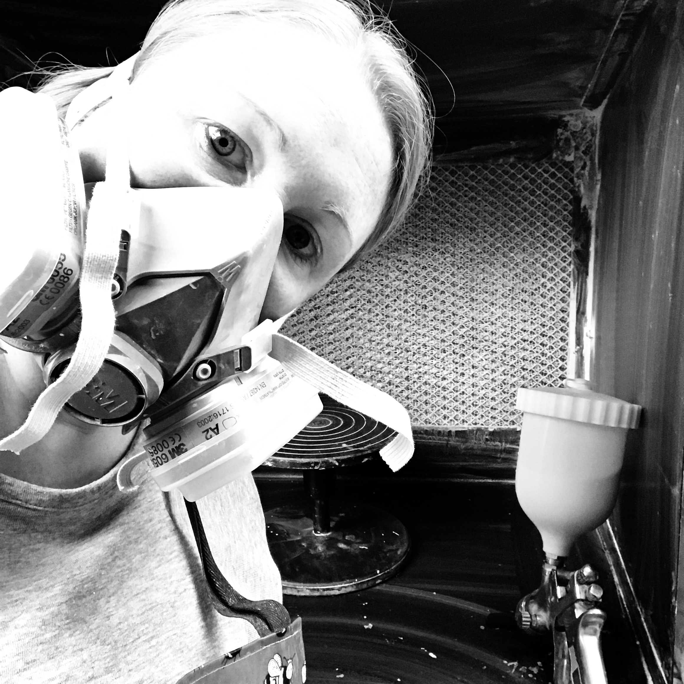 Spraying glaze in my workshop