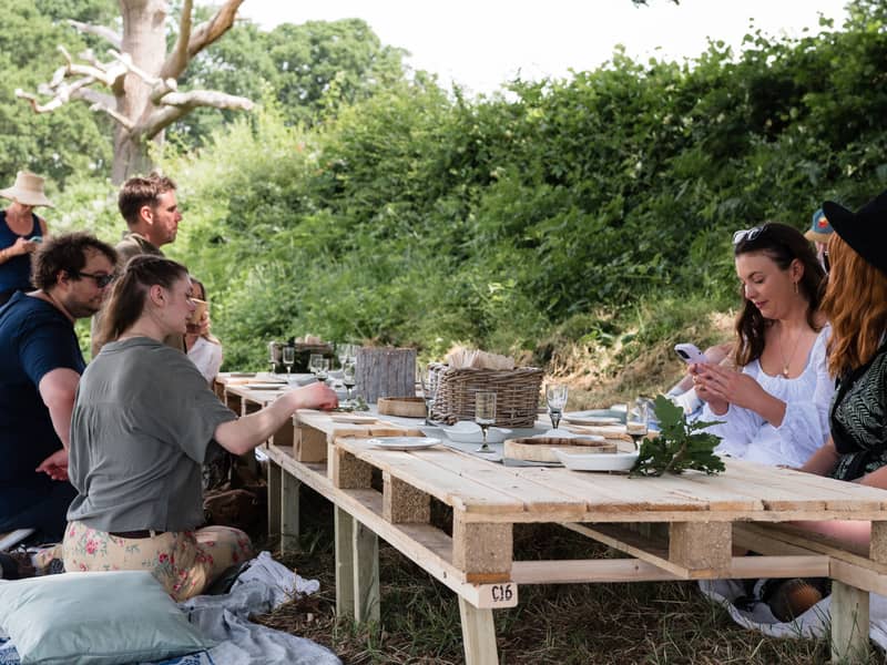 A group sitting at a table outside