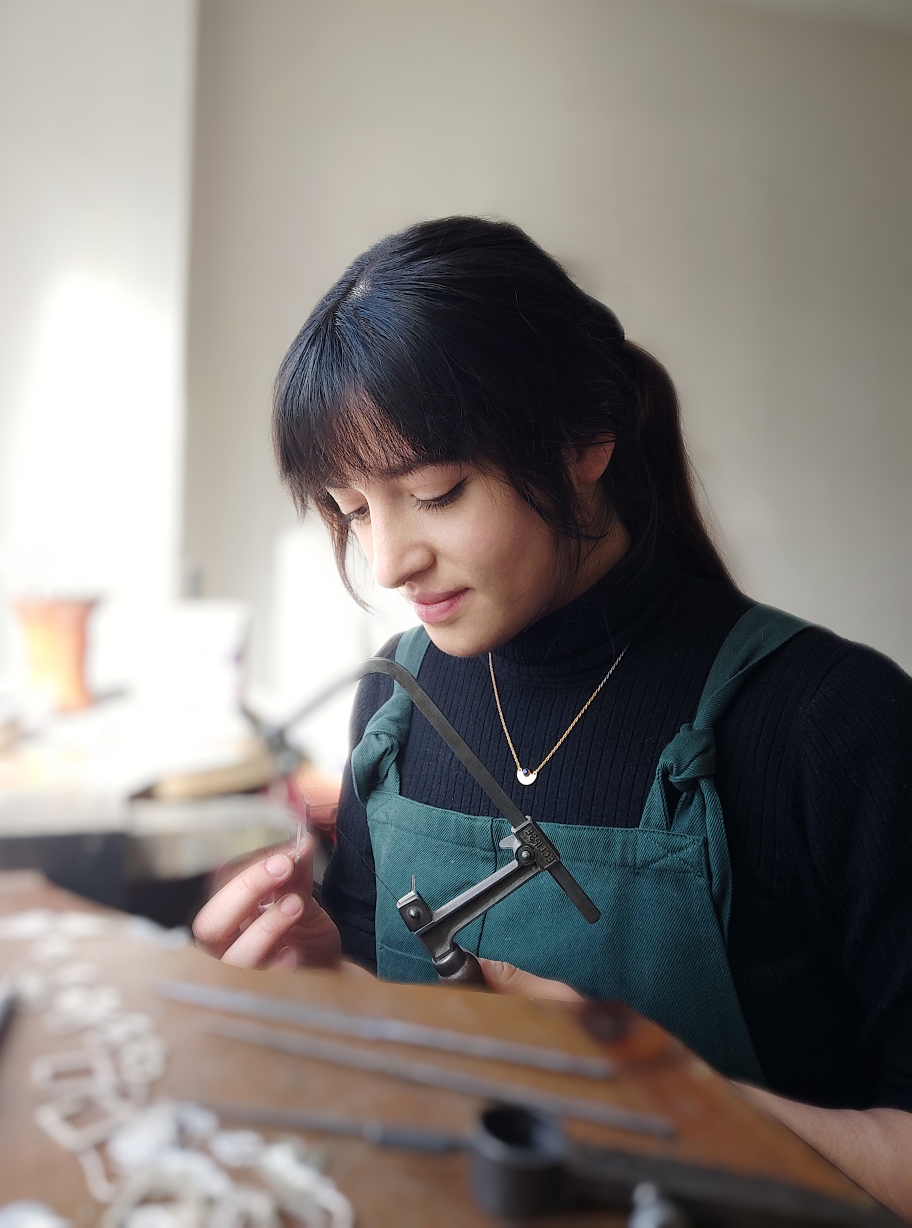 Kiya making jewellery in the workshop