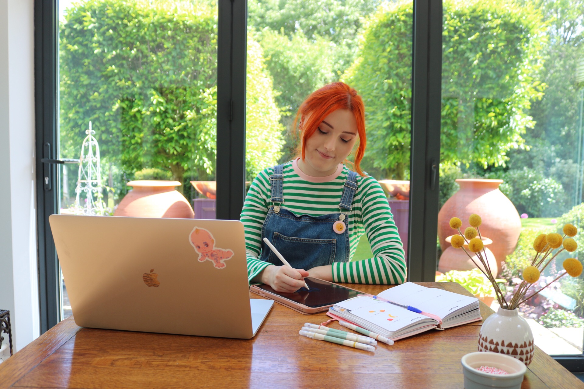 image of Mabel illustrating in her studio