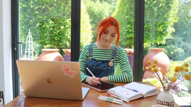image of Mabel illustrating in her studio