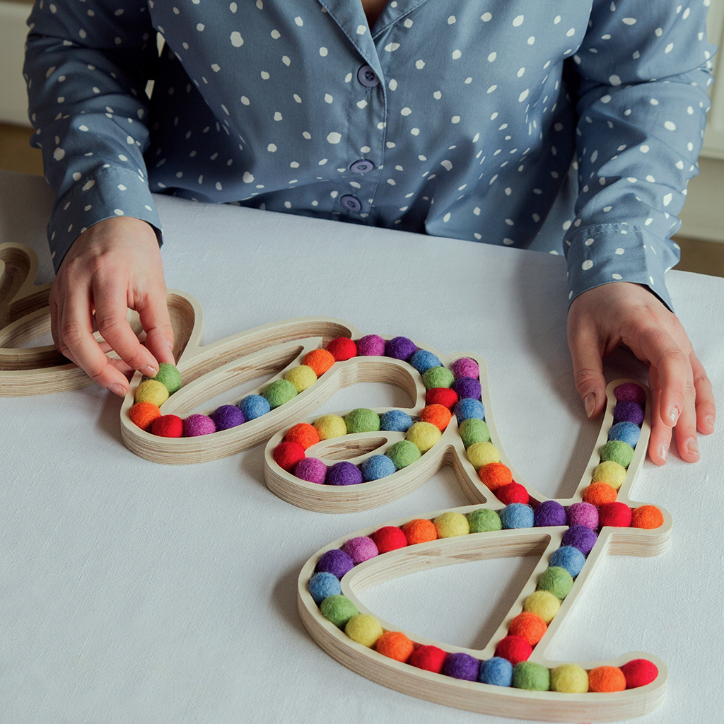 Placing the wool balls in place before gluing