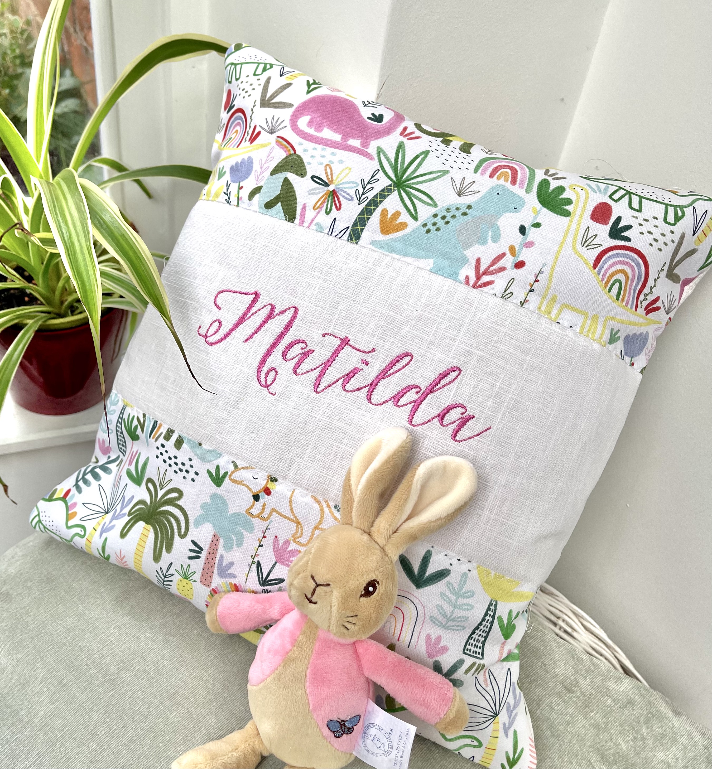 Multi coloured dinosaurcushion 