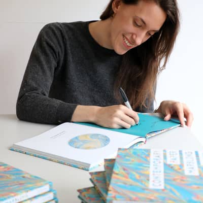 Lucy signing copies of her book 'Contemporary Paper Marbling'