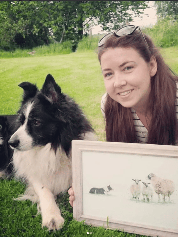 business owner with pet dog and border collie painting