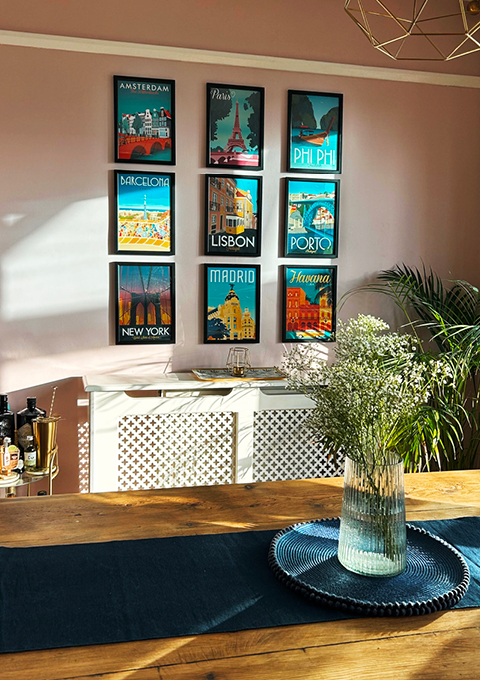 Gallery wall featuring travel poster collection