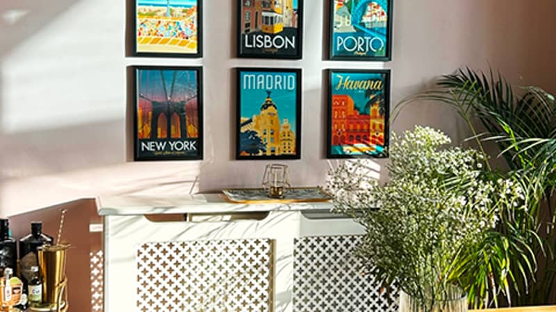 Gallery wall featuring travel poster collection