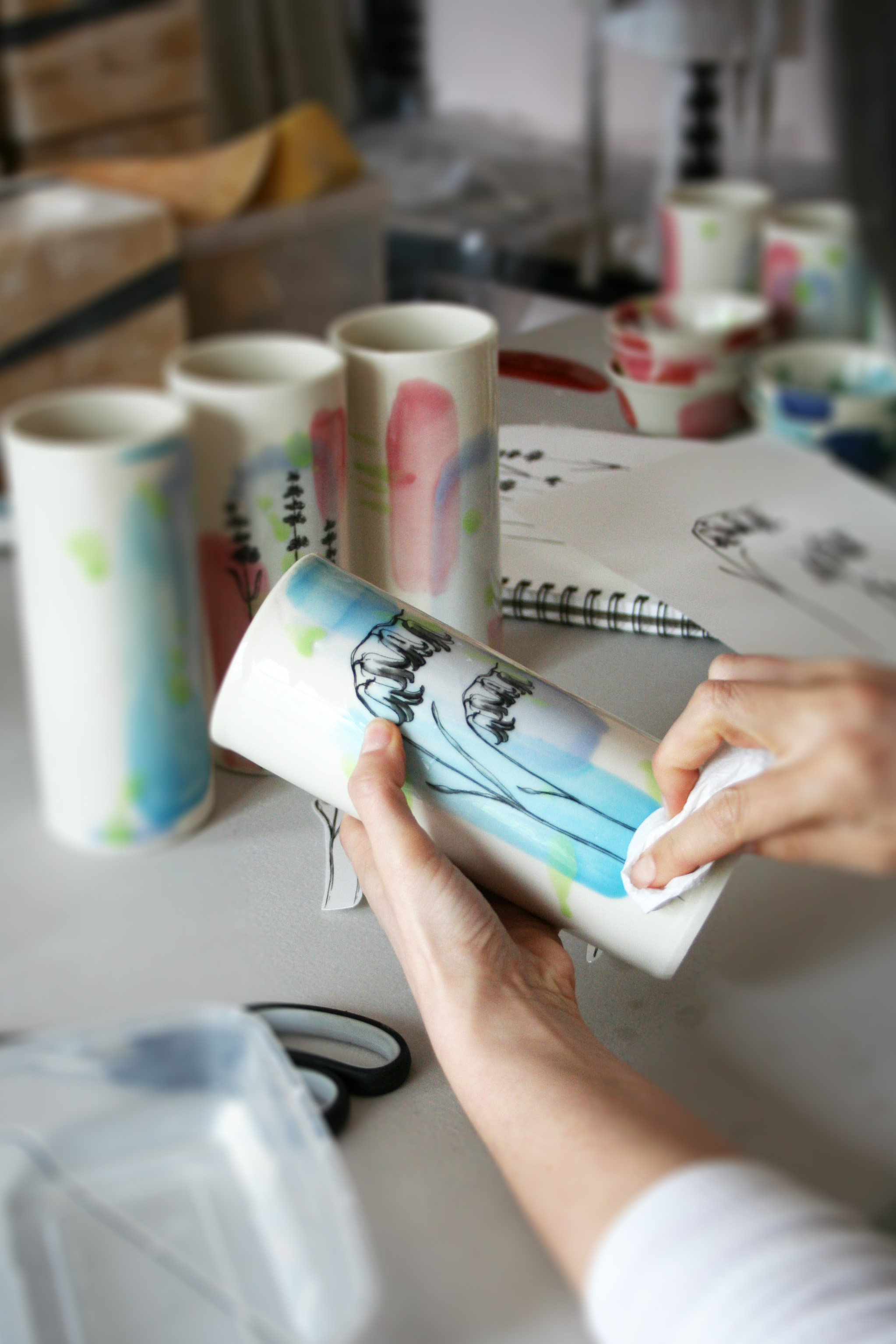 Adding ceramic decals to pottery