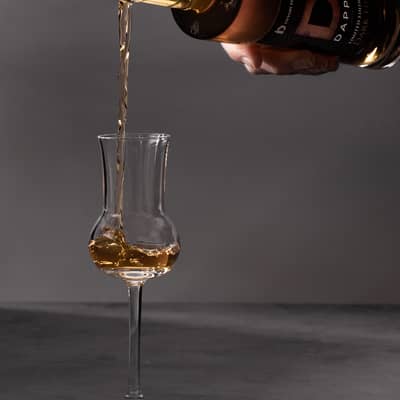 Dark Fire being poured into a glass