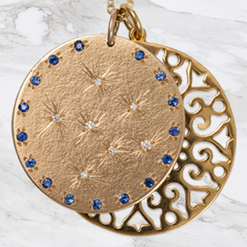 9ct Yellow Gold medal with set Diamonds and Blue sapphires with a  large lace flower disc pendant