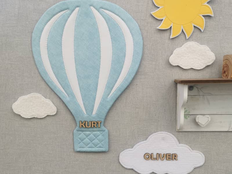 A beautiful addition to a nursery or bedroom. A personalised hot air balloon with wooden letters