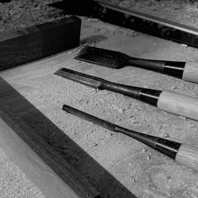 Toby Froment chisels on work bench