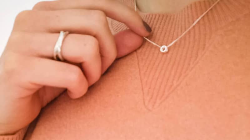 Alice, Founder of My Self-Care Edit wearing the Hug necklace