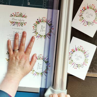 Hand cutting wedding invitations