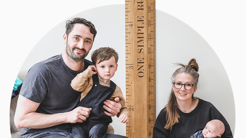 The Dobson family with a height chart ruler
