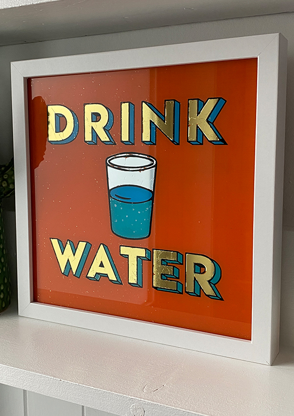 Hand made gold gilded retro sign on glass