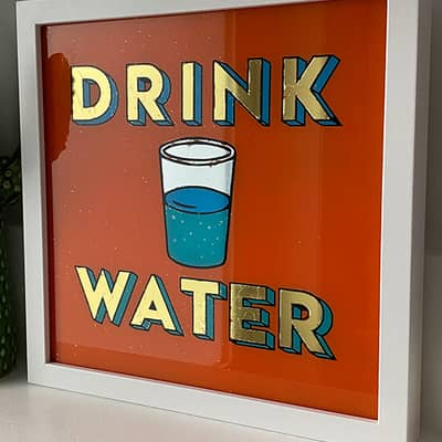 Hand made gold gilded retro sign on glass