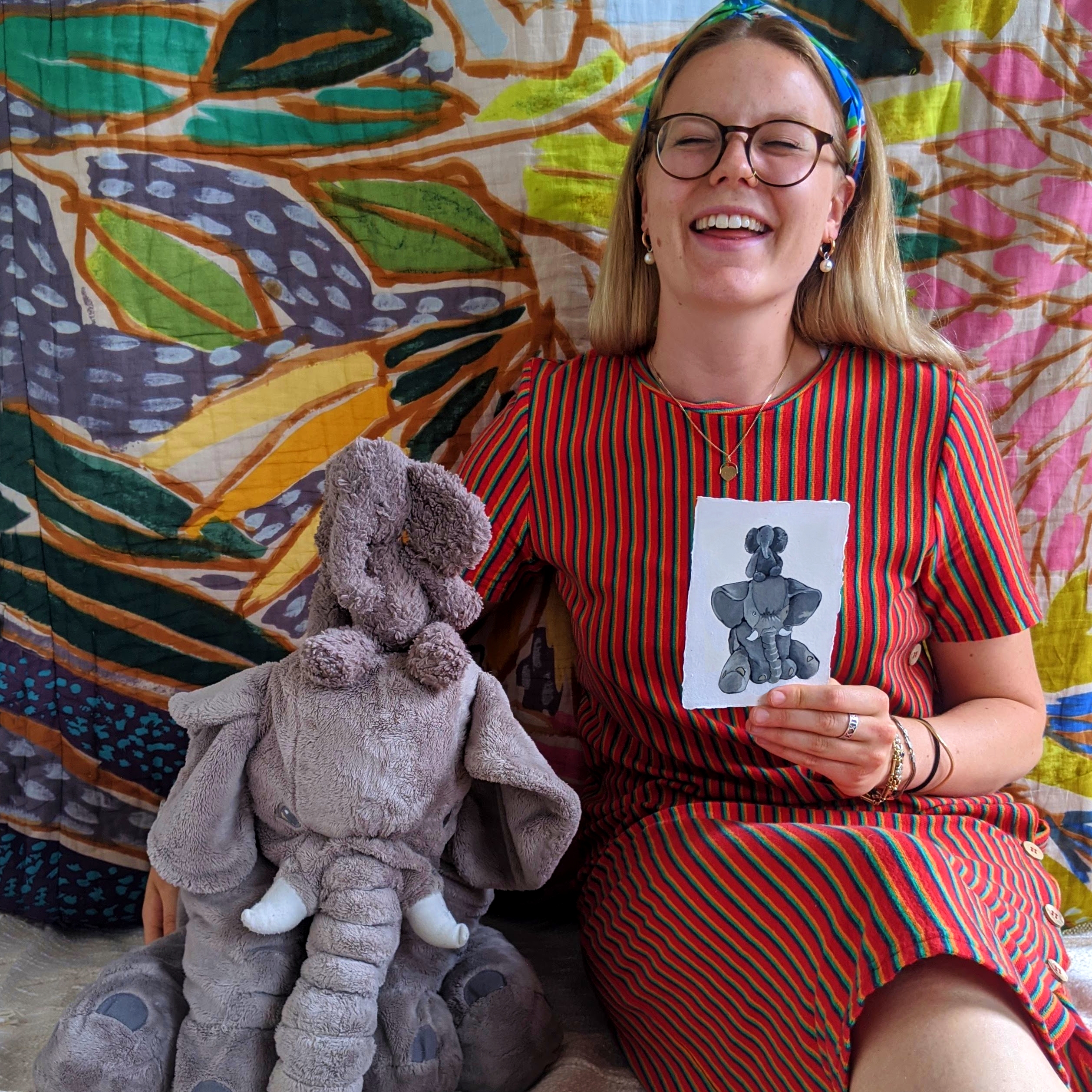 Illustrator, Gaby, with soft toys and their portraits