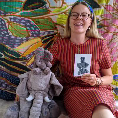 Illustrator, Gaby, with soft toys and their portraits