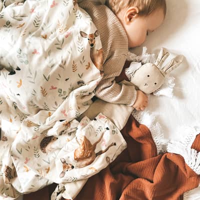 Keeping cosy in our woodland animal swaddle and tassel blanket