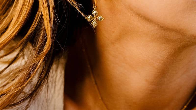 Rebecca wearing Tekhenu Cross Earrings and Necklace