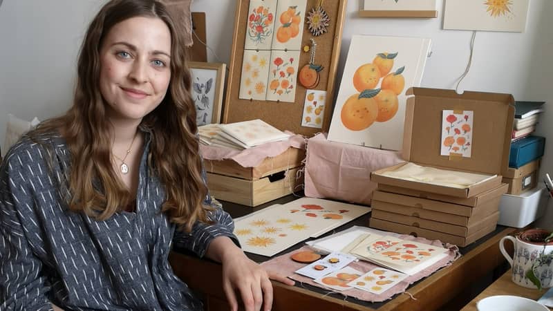 Photo of Bryony Moss, London Based illustrator sat at her studio in Peckham