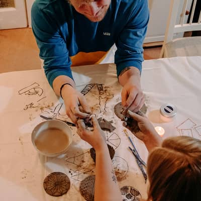 Couple holding hands pottery making Box42