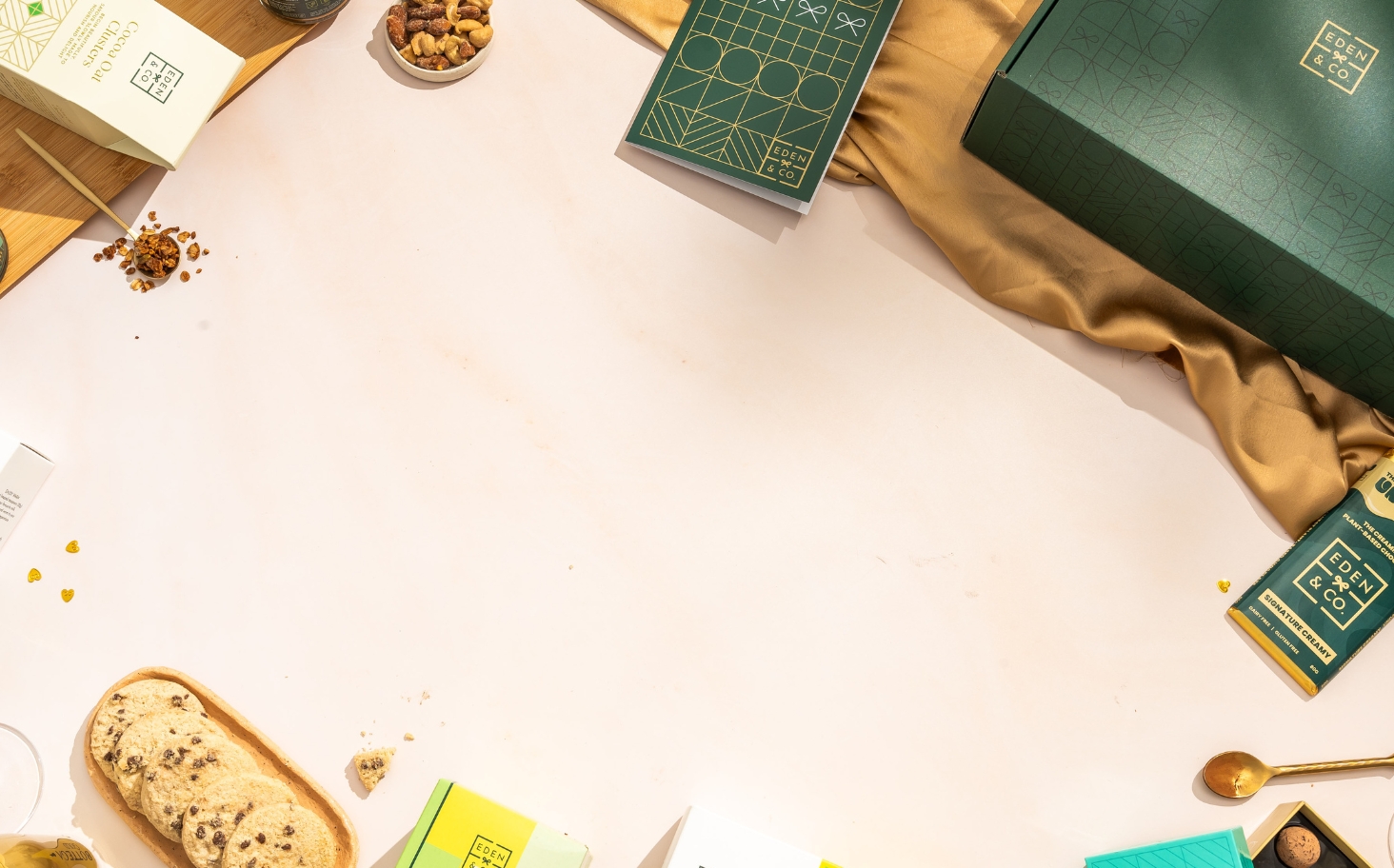 Green EDEN & CO hamper with products surrounding it