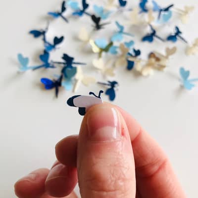 Erika folding the dragonfly wings by hand
