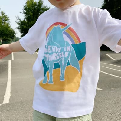 A collection of bespoke illustrations, family portraits and typography prints arranged on the bedroom wall by la Fam Illustration.