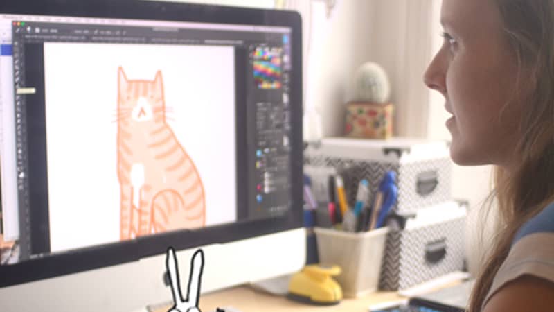 Sarah drawing at her desk