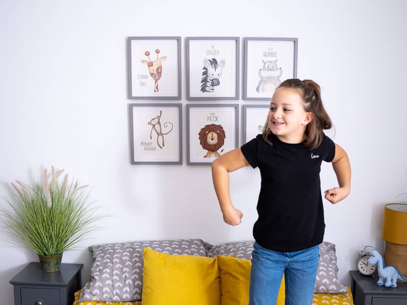 Safari animal prints hanging above bed