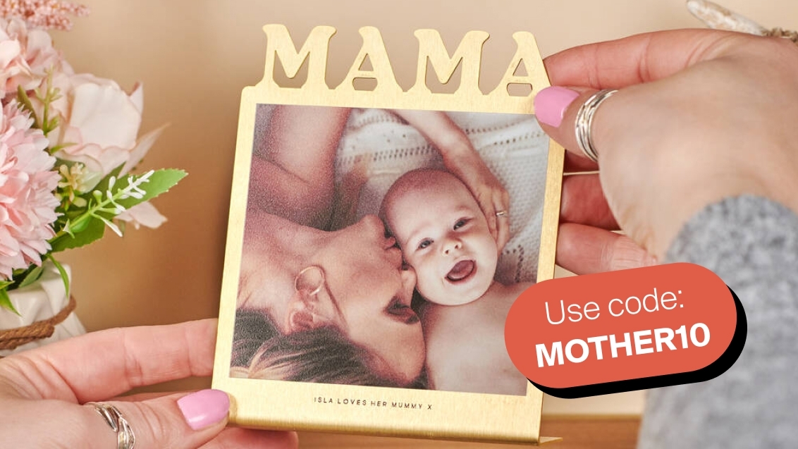 two women wearing Christmas jumpers